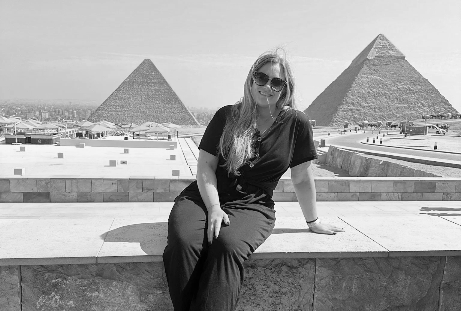 Sophie Lancaster sitting in front of the pyramids in Giza